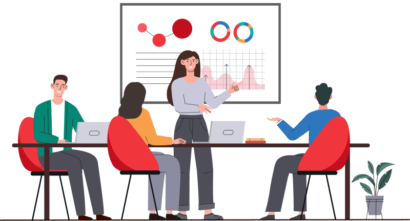 A training session with participants at a table, one person presenting data on a screen.​